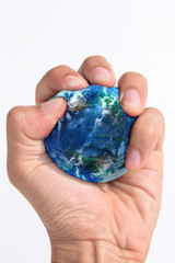 Hand squeezing earth