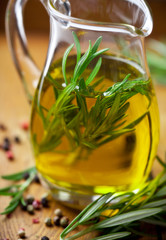 Olive oil with rosemary in a glass jug