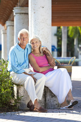 Fototapeta premium Happy Senior Couple Smiling Outside in Sunshine
