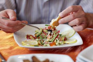 Man eats salad