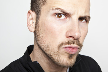 Obraz premium young man's face, intense look