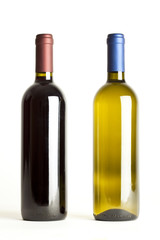 Red and white wine bottles on white background