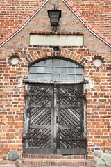 Old wooden door of an antique building