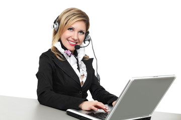 Young businesswoman with laptop and headset