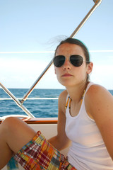 Pretty young woman on sailboat