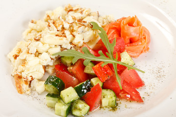 Scrambled eggs with salmon and vegetables