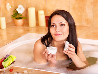 Woman take bubble  bath.