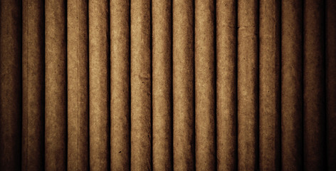 Vintage background with cigarettes on brown wooden background