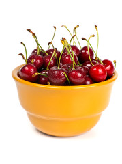 Full bowl with ripe sweet cherries isolated on white