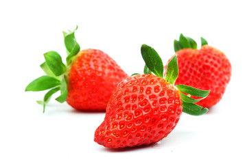 three strawberries isolated
