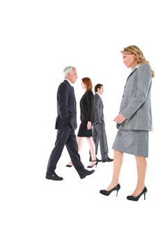 businessman and businesswoman walking in different directions