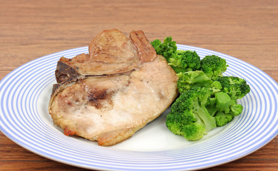 Pork chop and broccoli on dish