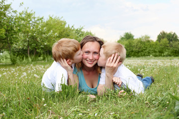 Naklejka na ściany i meble mother with her two sons outdoors