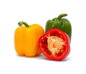 Three sweet peppers in yellow, red and green color