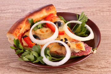 tasty pizza with olives on a wooden background