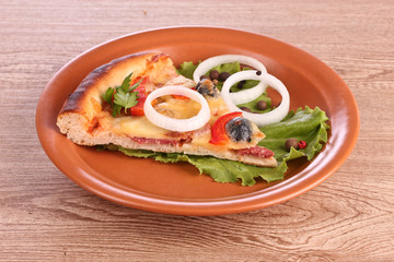 tasty pizza with olives on a wooden background