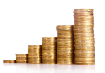 Many coins in column isolated on white