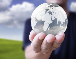 glowing earth globe in his hands