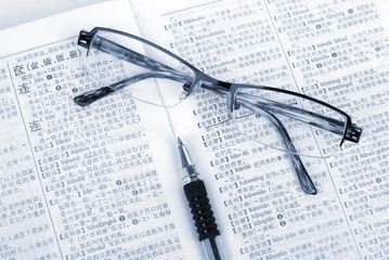 Book,pen and glasses