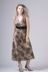 Fototapeta premium Beautiful young woman in a dress