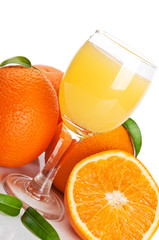 Orange juice in glass and fruits