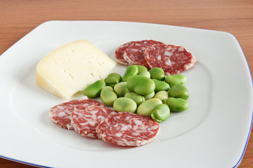 dish with beans salami and cheese - fave salame e pecorino