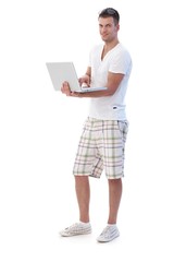 College student browsing internet smiling