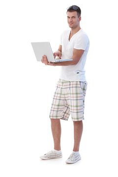 College student browsing internet smiling