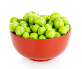 green peas in a brown bowl, isolated on white