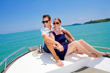 Couple Relaxing On A Boat