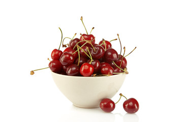 Sweet red cherries in ceramic bowl