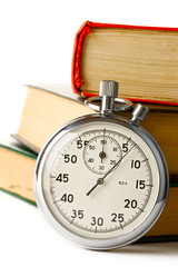 Stopwatch and books on the white background