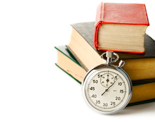 Stopwatch and books on the white background