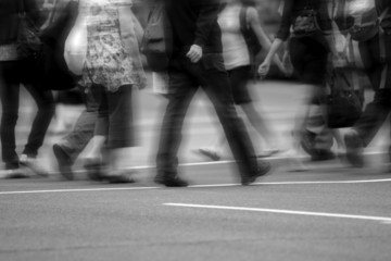 Crowd of people crossing the street