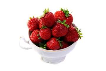 Ripe strawberries in a porcelain cup.