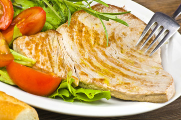 tuna steak cooked on white plate