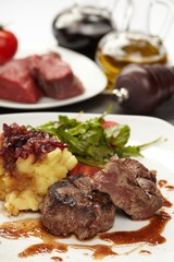Beef steaks with vegetables