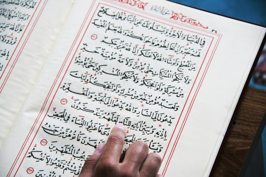 girl reading the Koran