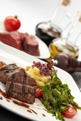 Beef steaks with vegetables