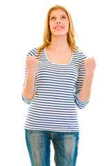 Excited teen girl enjoying her success isolated on white.