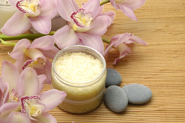 Obraz na płótnie Canvas bowl of salt and pink orchids and stones - Spa essentials