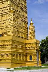 gold thai temple and blue sky