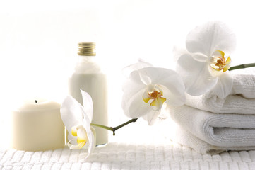 Obraz na płótnie Canvas health spa with white orchid, bottles with essential oil