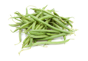 raw long green beans over white background