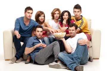 friends sitting comfortable with popcorn