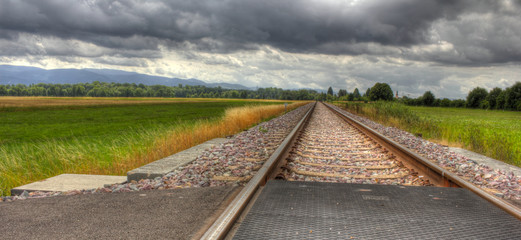 Railroad under dramatic sky