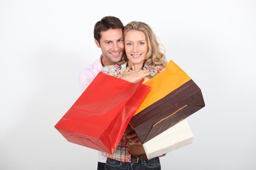 Couple holding  shopping bags