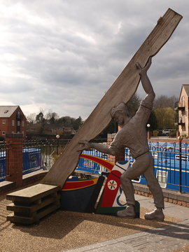 Canel man with plank of wood