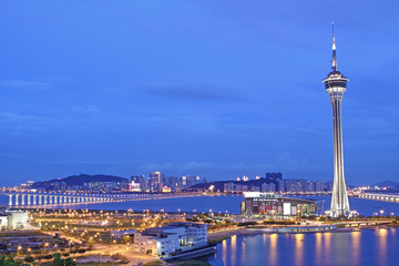 Urban landscape of Macau with famous traveling tower under sky n