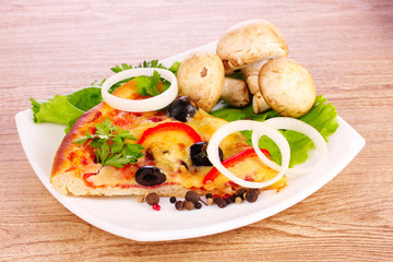 tasty pizza with olives on a wooden background